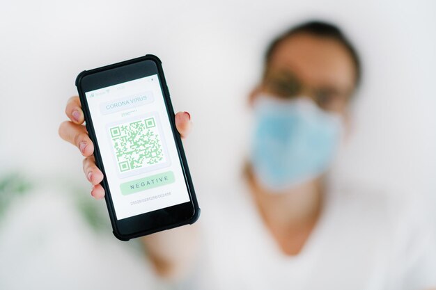 Corona Virus Smartphone App with QR Code System for Controlling and Monitoring Health Status