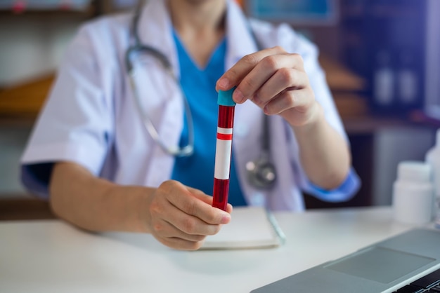 Coronavirus blood test Doctor holding test glass tube Medical concept