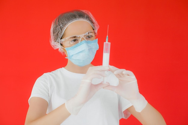 Coronavirus concept COVID19 Young female doctor in protective suit uniform face mask and rubber gloves before patient examination feeling exhausted and worried Doctors are heroes