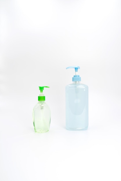 Coronavirus COVID19 protection blue and green gel sanitizer set isolated on white background in studio light