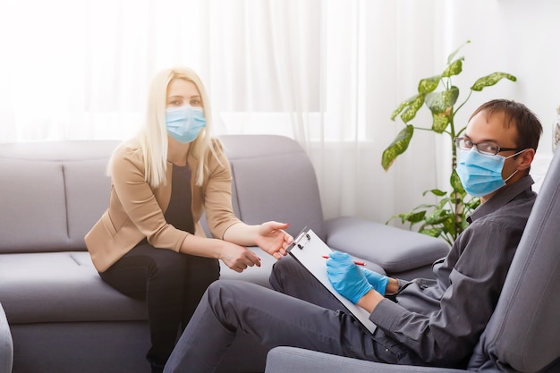 Coronavirus epidemic. psychologist and patient with protection mask. during quarantine coronavirus