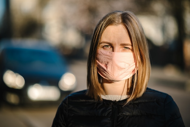 Coronavirus. Girl with mask during COVID-19 pandemic at the street