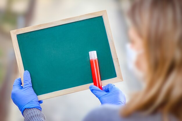 A Coronavirus Outbreak of the corona virus. Epidemic Viral Respiratory Syndrome. Girl's Plate in Hands. China