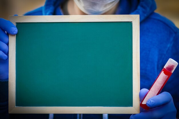 Coronavirus outbreak. Epidemic viral respiratory syndrome. Board in men's hands. China