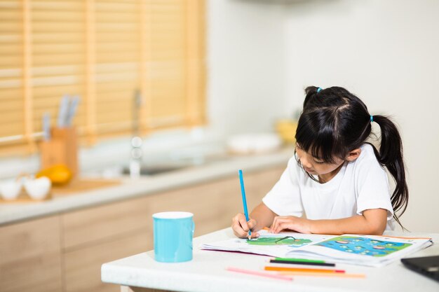 Coronavirus outbreak lockdown and school closures schoolgirl watching online education class happy talking with teacher on the internet at home covid19 pandemic forces children online learning