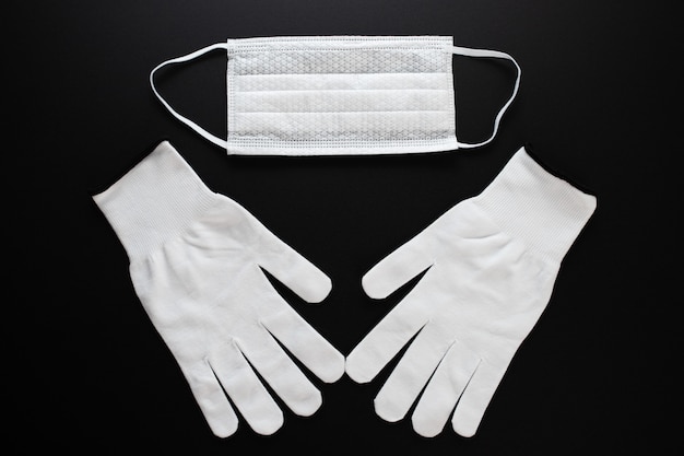 Coronavirus protection. White antibacterial medical mask and gloves