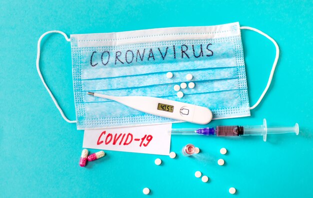 Coronavirus. Remedies. Masks on a blue surface. Selective focus.