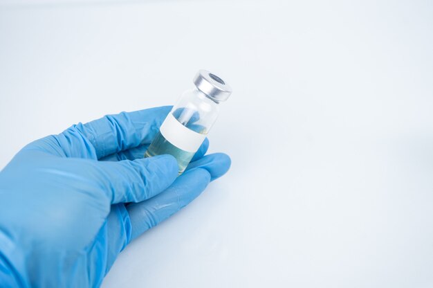 Coronavirus vaccine in bottles with syringe for injection.