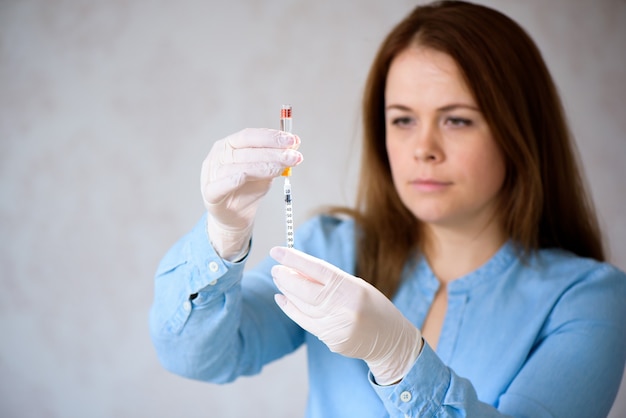 Coronavirus vaccine. A doctor makes a coronavirus vaccine at a hospital.