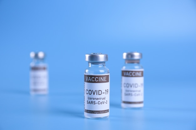 Coronavirus vaccine - The medical concept. Ampoule with Covid-19