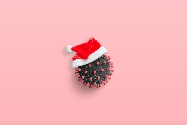 Coronavirus with Santa Claus hat concept