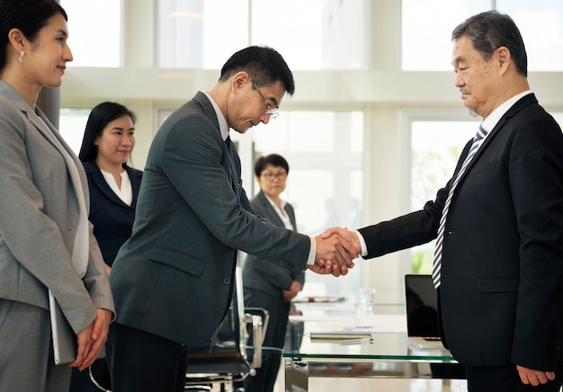 Corporate business people handshaking