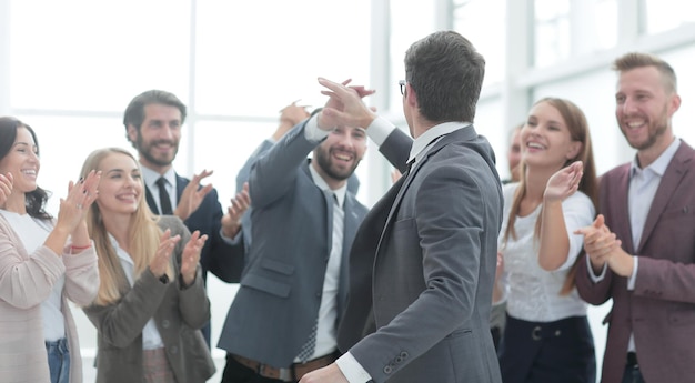 Corporate business team congratulating project manager on
success