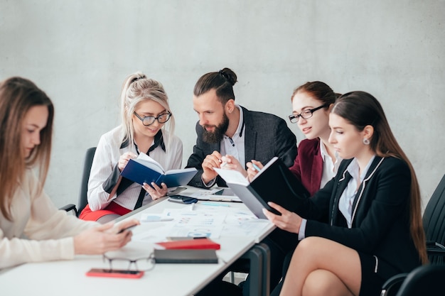 Corporate employees. business matters discussion. solid team ignoring lonely colleague.