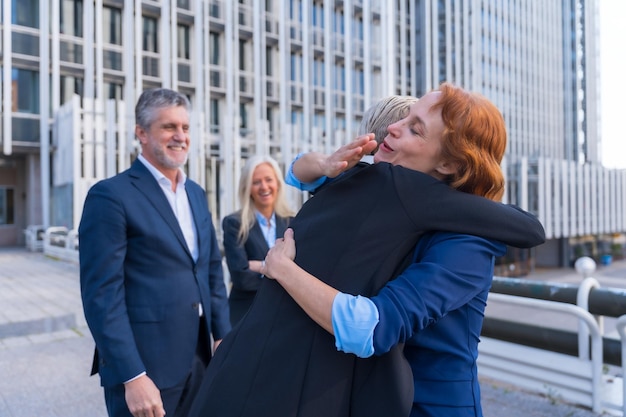 Corporate Executives Greeting Each Other in a Business District