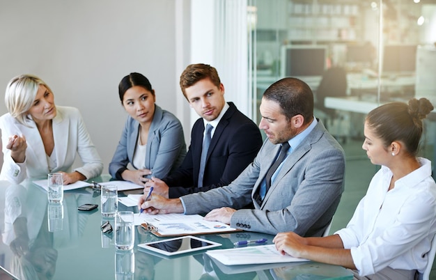 Corporate group in business meeting team discussion in conference room with diversity in workplace Men women and professional planning with conversation collaboration and analytics paperwork