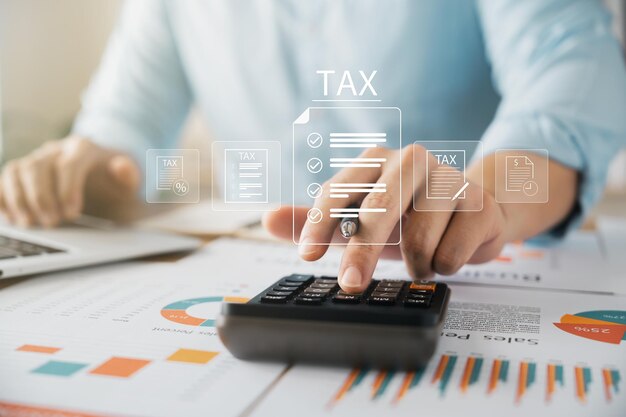 corporate and individual tax payment concept businessman using computer filling out corporate and personal income tax return vat and property tax of business