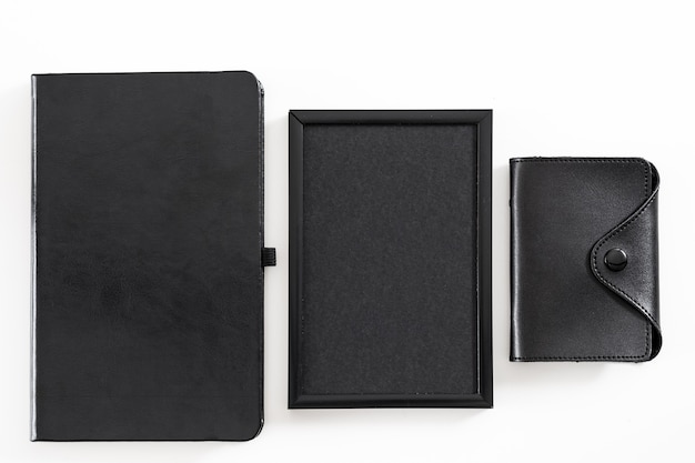 Corporate lifestyle. Office worker supplies set. Flat lay of business card holder, blank photo frame, address book