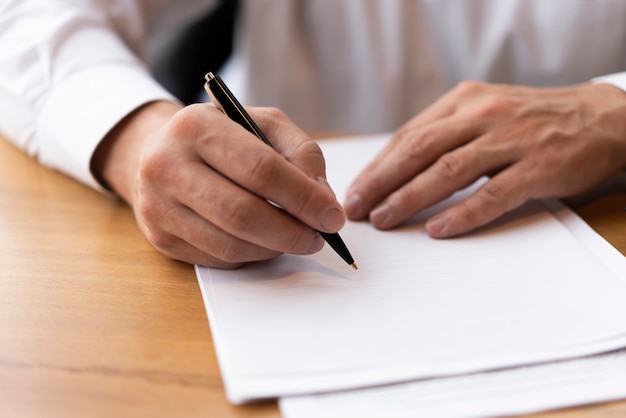 Photo corporate man writing on blank paper