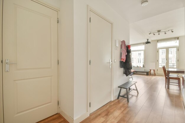 A corridor leading inside a cozy apartment