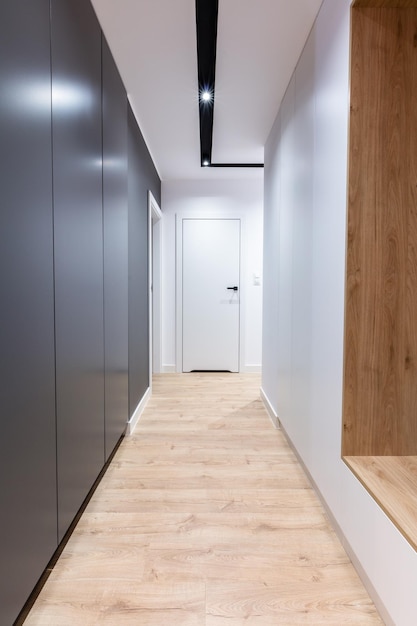 Corridor in modern design apartment with closet and seat