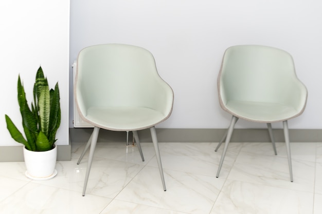 Corridor with chairs for patients in a modern hospital.