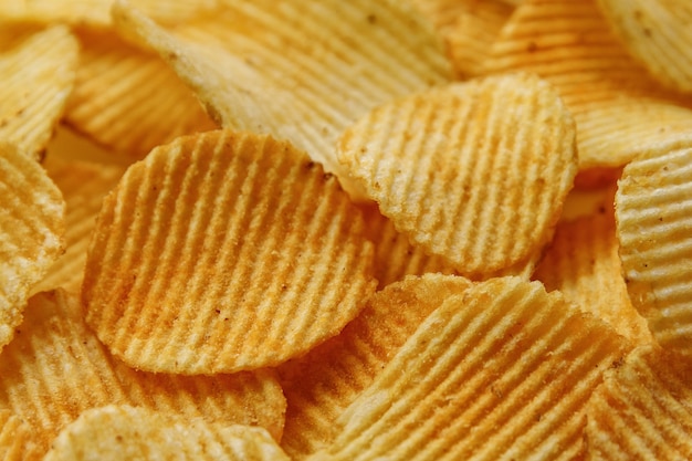 Corrugated Potato Chips. Food background. Top view.