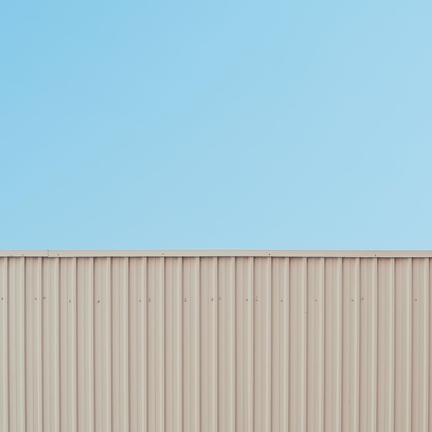 Corrugated wall against clear sky