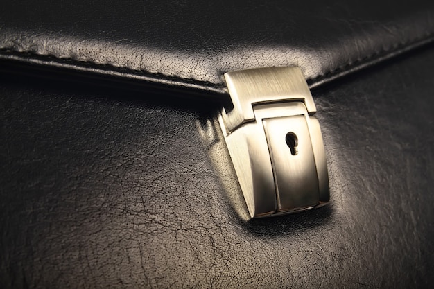 Photo coseup of lock on leather business case