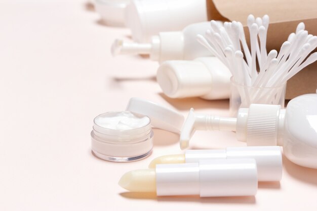 Photo cosmetic beauty products and accessories with paper packaging bag. selective focus, copy space
