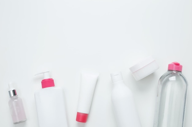 Cosmetic beauty products on white background Bottles and tubes with branding mock up