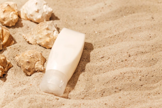 cosmetic bottle mockup on sand