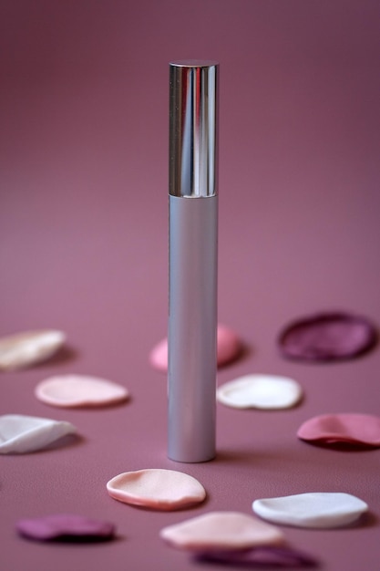 cosmetic bottle on pink background