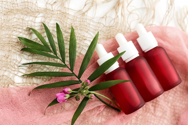 Cosmetic bottles and pink oil bottles