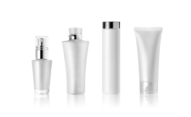 Cosmetic bottles and tube isolated on white. Blank label for branding mockup.