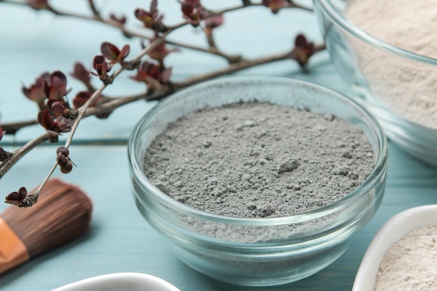 Cosmetic clay. clay facial mask on a gentle blue background. different types of clay. natural cosmetics for cosmetic procedures. Beauty concept.