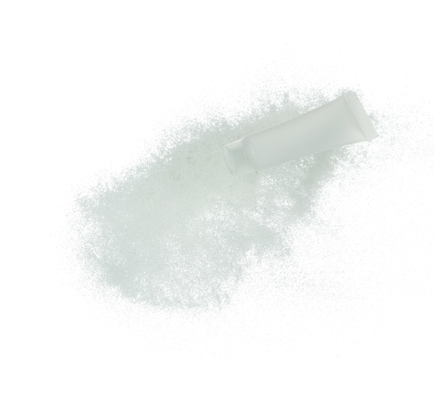 Cosmetic container white bottle fly splashing on white sand Tube transparent sand powder in mid air Moisturizer lotion cream bottle explosion flying White background isolated high speed shutter