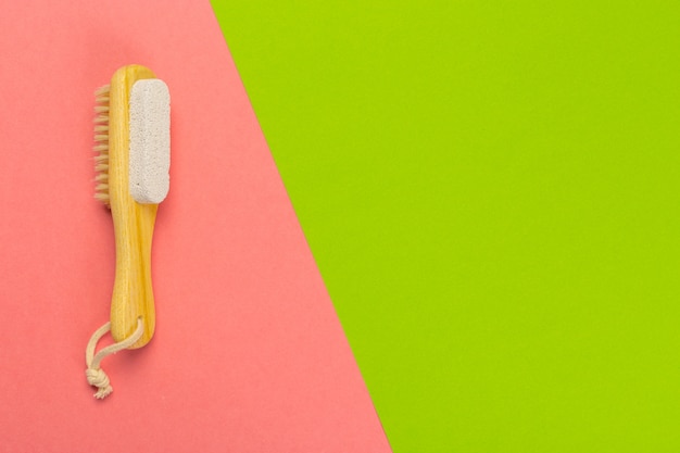 Photo cosmetic pumice on a bright  bicolor background, top view