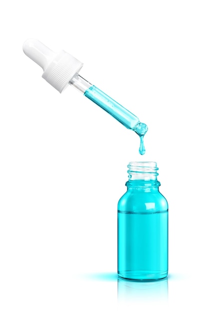 Cosmetic serum drop falls from a pipette into a blue bottle isolated on white background, Cosmetic and beauty concept