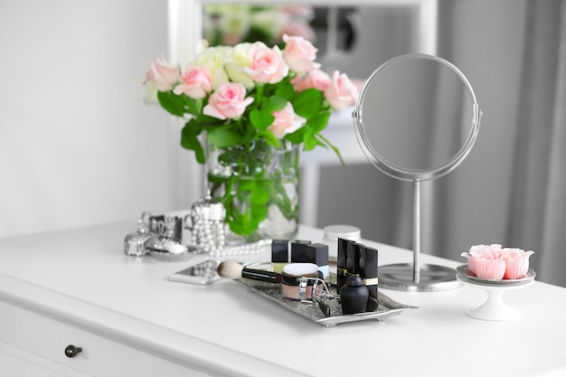 Photo cosmetic set on light dressing table