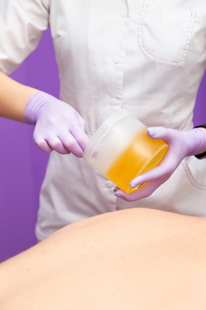 Cosmetician doing a procedure to a client