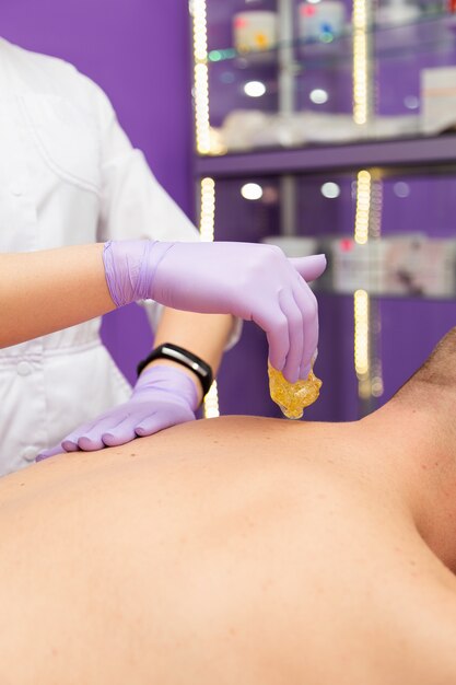 Cosmetician doing a procedure to a client