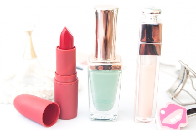 Cosmetics and beauty products on white tables