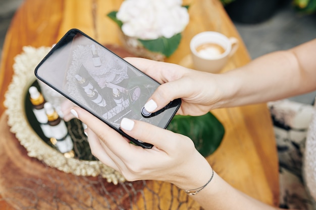 Cosmetics brand owner photographing products