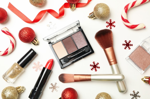 Cosmetics and Christmas baubles isolated