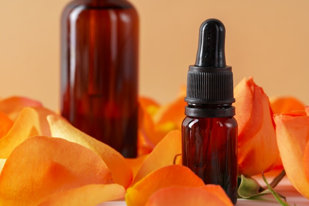 Cosmetics containers decorated with orange rose petals