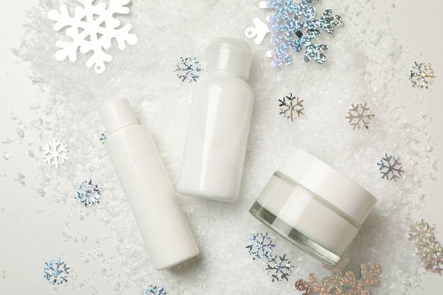 Cosmetics isolated with decorative snow