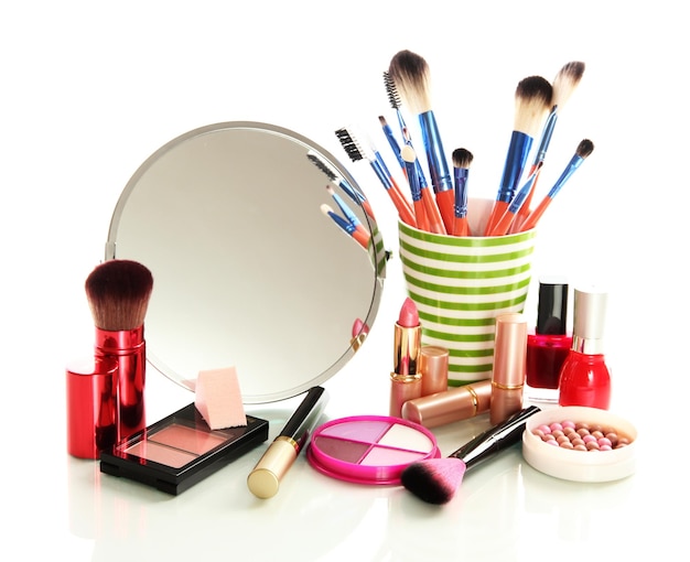 Cosmetics near mirror isolated on white