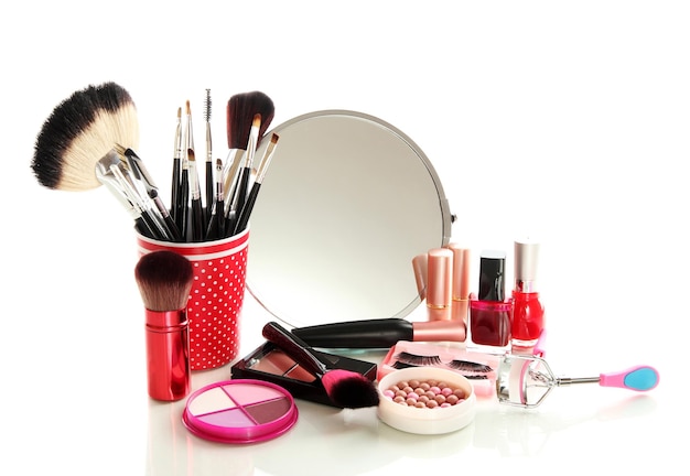 Cosmetics near mirror isolated on white