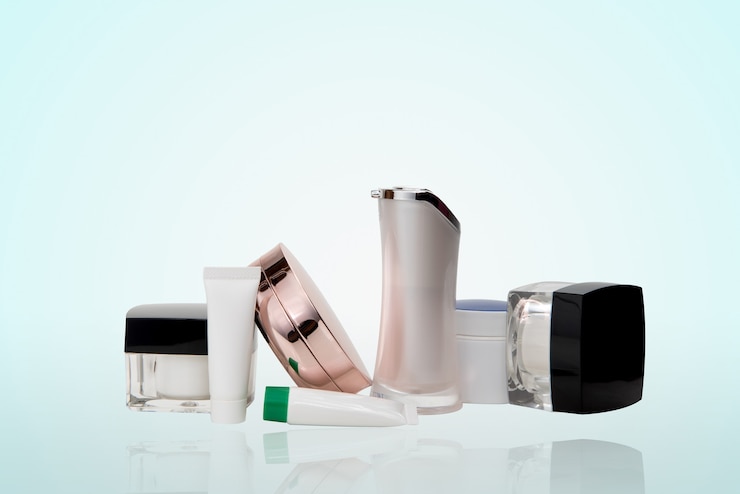 Photo cosmetics onclear background, many cosmetic and reflection on glass